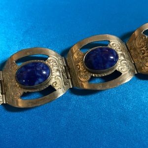 The bracelet is from Mexico. It is sliver with blue stones very old